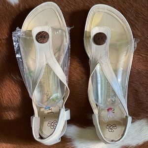 Thong sandal with wooden button worn few times